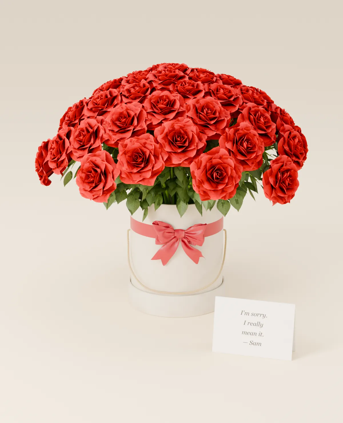 Red roses in a box with an “I’m sorry” card
